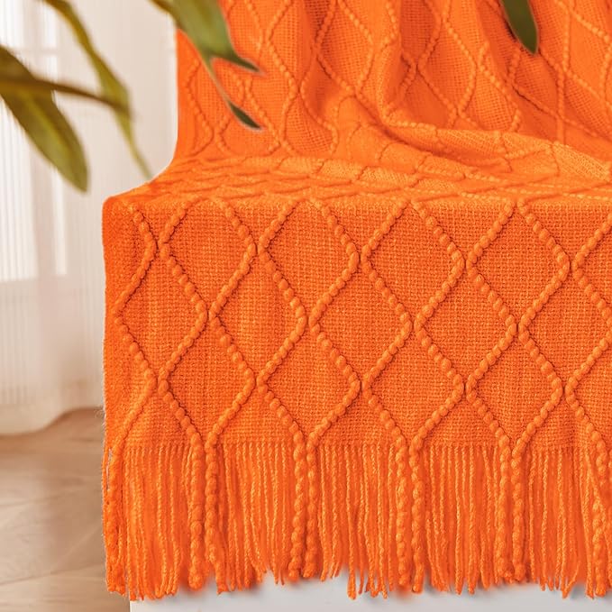 CozyNest Decor burnt orange fall throw blanket on a couch, soft knitted autumn decor for living room or outdoor use, 50x60 inches