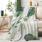 Sage green leaf throw blanket by CozyNest Decor, soft boho flannel with gold accents, 50x60 inches, cozy decorative blanket for sofa or bed