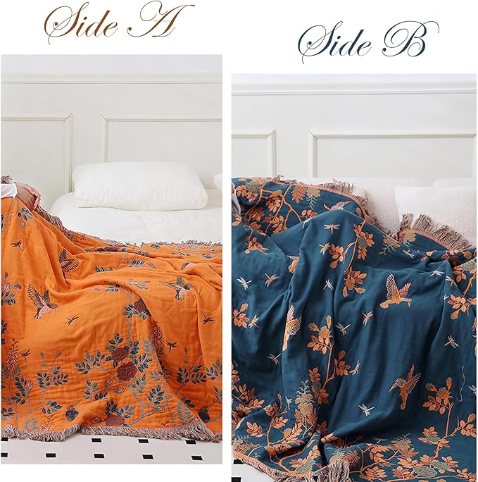 CozyNest Decor boho throw blanket in orange, 100% organic cotton muslin with floral and bird design for bed or sofa decor.