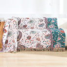 CozyNest Decor large boho cotton throw blanket with tassels, soft rustic quilt for sofa, bed, or travel decor.
