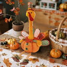 CozyNest Decor plush Thanksgiving turkey figurine with stretchable head, sitting plush turkey for fall home decorations.