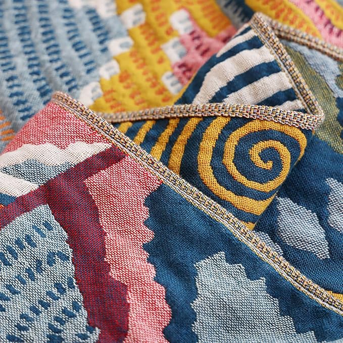 CozyNest Decor boho twin size muslin blanket with floral star pattern, 4-layer gauze cotton, soft, lightweight, suitable for sofa or bed.