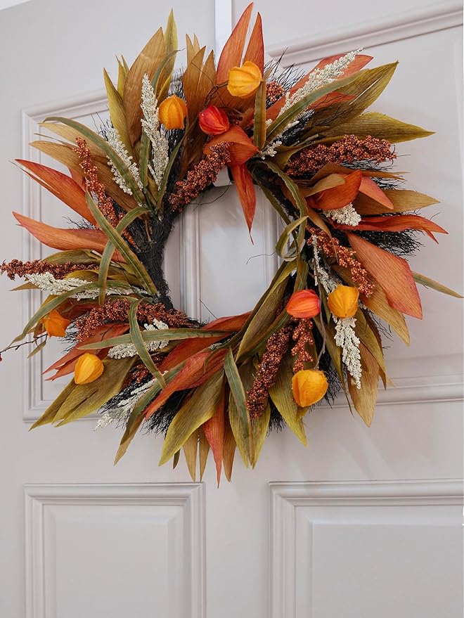Rustic 24-inch fall corn husk and berry wreath with orange, yellow, and brown accents, perfect for farmhouse front door decor.