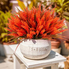 CozyNest Decor faux lavender and monkey grass artificial flowers in autumn-red, outdoor UV-resistant plastic plants for garden or porch.