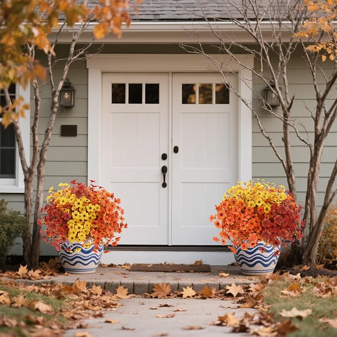 Set of 12 artificial fall flowers including faux mums and daisies in orange, brown, and yellow for outdoor or indoor fall decor.