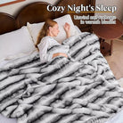 CozyNest Decor luxury faux fur blanket in black and white, soft plush throw on a sofa for cozy bedroom or living room decor.
