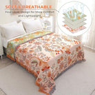 CozyNest Decor boho fall throw blanket in orange and sage green with floral print, soft breathable cotton for bed or sofa, 60x80 inches.