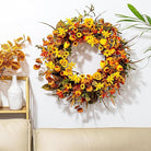 CozyNest Decor 22-inch rustic fall wreath with orange tulips, wildflowers, and autumn foliage for front door or wall decoration.