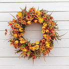 CozyNest Decor 22-inch fall wreath with orange tulips, wildflowers, and rustic autumn floral accents for front door or wall decor.