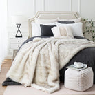Luxurious ivory white faux fur throw blanket by CozyNest Decor, fluffy, soft, and cozy for bed or couch, reversible to plush velvet.