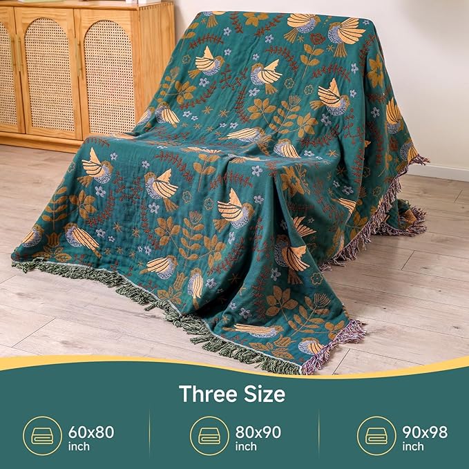 CozyNest Decor fall throw blanket with bird and flower patterns, versatile organic cotton blanket for beds, couches, and vintage décor.