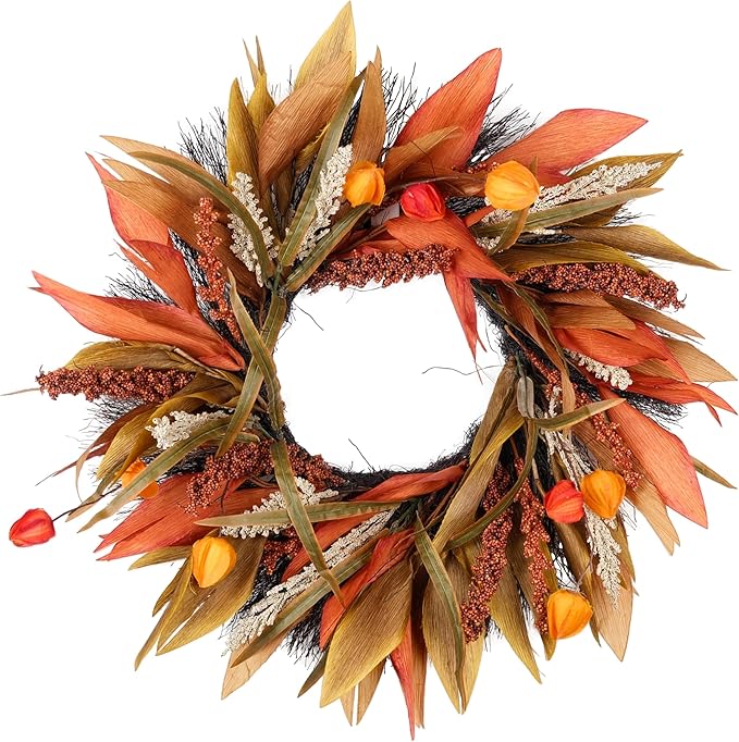 Rustic fall door wreath with corn husks, berries, and autumn foliage in orange, yellow, and brown for farmhouse decor.
