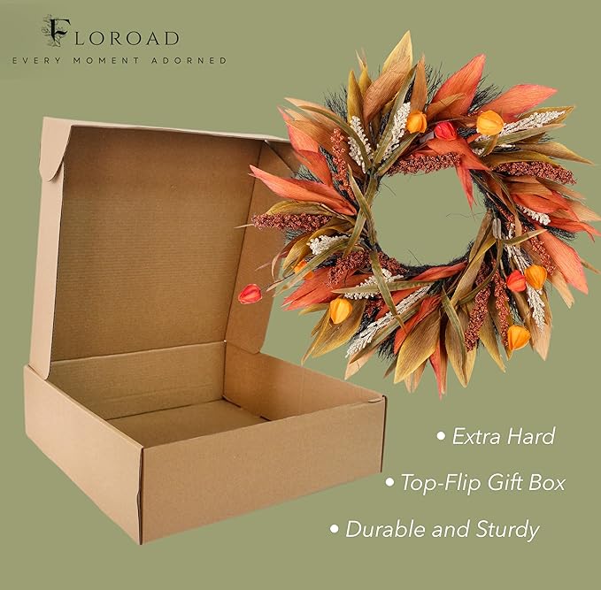 Rustic 24-inch fall door wreath with corn husks, berries, and autumn leaves in orange, yellow, and brown for farmhouse decor.