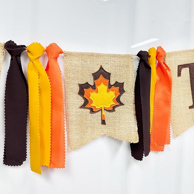 CozyNest Decor Thanksgiving burlap banner with maple leaf and fall-colored ribbon for autumn harvest and holiday celebrations.