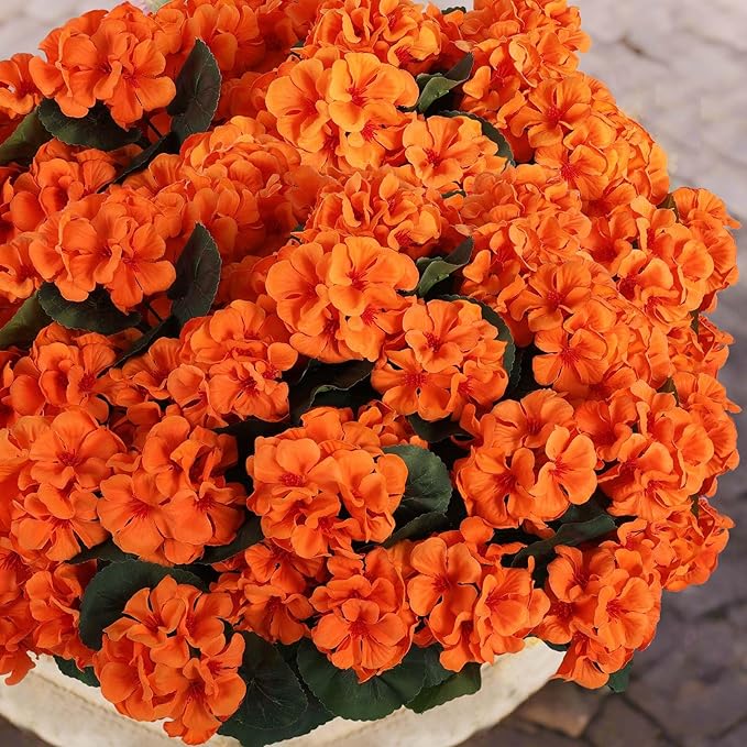 CozyNest Decor 12-piece orange artificial geranium flowers for outdoor use, UV resistant silk faux fall flowers for home and autumn decor.