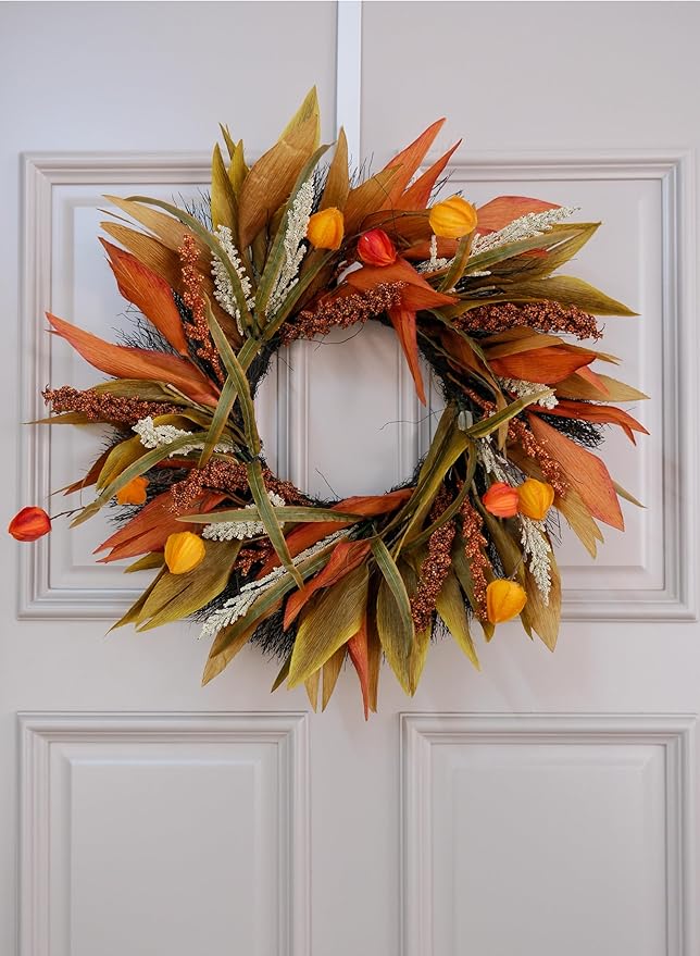 Rustic 24-inch fall corn husk and berry wreath with orange, yellow, and brown accents for front door or porch decor.