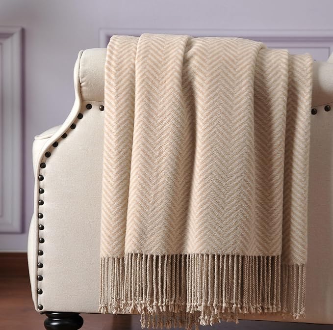 CozyNest Decor silk throw blanket with hand-knotted fringe in taupe, soft, breathable, and featuring a herringbone pattern.