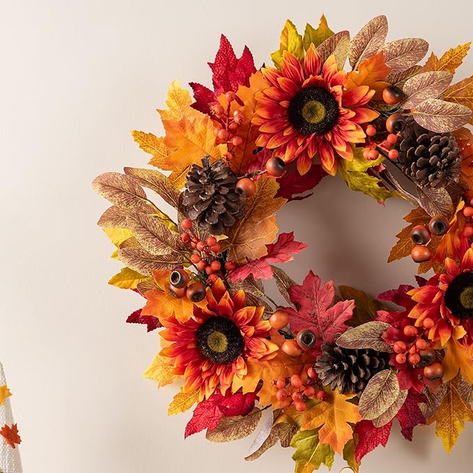 CozyNest Decor 24-inch artificial fall wreath with sunflowers, pinecones, and berries, ideal for front door or indoor holiday decor.
