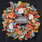CozyNest Decor 24-inch autumn wreath with lamb's ear leaves, roses, berries, wooden sign, perfect for front door fall decor.