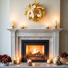 Rustic fall wreath by CozyNest Decor with golden eucalyptus, white pumpkins, wheat, and a bow, perfect for front door decor.