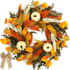 Rustic fall wreath with white pumpkins, wheat, golden eucalyptus, and bow for front door decor, perfect for autumn and Thanksgiving.