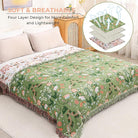 CozyNest Decor boho cotton throw blanket with floral and animal prints, large rustic quilt for bed, sofa, or chair, 90x98 inches.