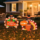 Outdoor metal fall decorations with LED lights, featuring Welcome pumpkin and turkey yard stakes for garden and lawn decor.