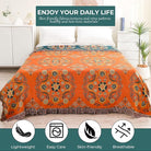 CozyNest Decor orange floral printed fall throw blanket on a bed, lightweight 100% cotton farmhouse quilt, 60x80 inches.