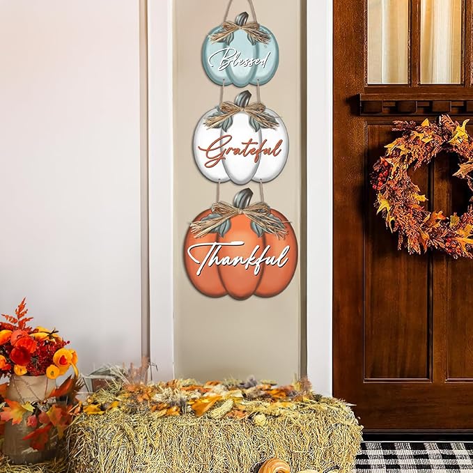 CozyNest Decor trio of pumpkin-themed wall signs with "Grateful," "Thankful," and "Blessed" for autumn harvest and Thanksgiving decor.