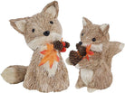 Set of two CozyNest Decor Fall fox figurines, handmade autumn-themed decorations for mantel or fireplace centerpieces.