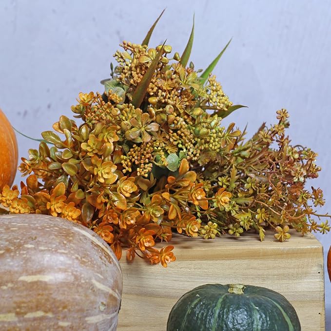 Six bundles of artificial fall flowers with green leaves, cozy autumn decorations for home, wedding, or outdoor seasonal decor.