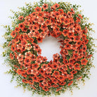 Large 26-inch artificial fall wreath with boxwood leaves, faux daisies, and eucalyptus for front door or porch decor in farmhouse style.