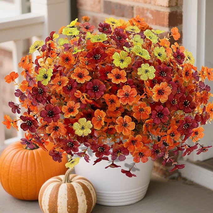 12 bundles of CozyNest Decor artificial fall flowers with faux mums in orange, brown, and yellow for outdoor or indoor fall decor.