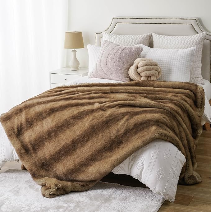 CozyNest Decor BATTILO HOME luxury ochre faux fur throw blanket on a sofa, plush and warm for home decor and comfort.