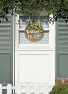 Rustic round wood wreath with seasonal welcome sign for front door, farmhouse outdoor wall decoration for spring to Christmas.