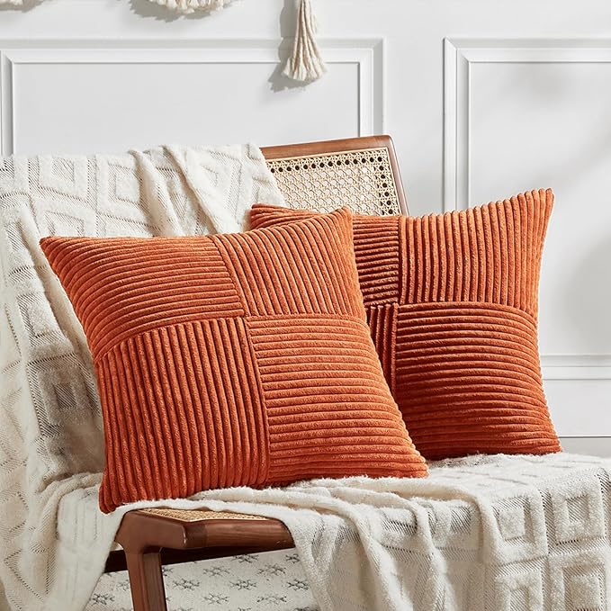 Set of 2 burnt orange decorative throw pillow covers with patchwork design, soft corduroy texture, 22x22 inches for living room or bedroom.