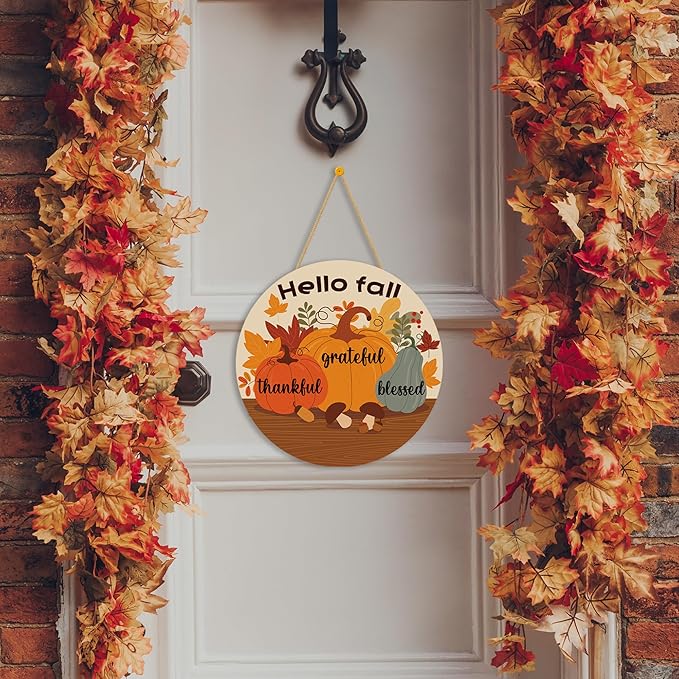 Rustic round wood wreath with maple leaves garland, perfect as a fall welcome sign for front door or porch decor.