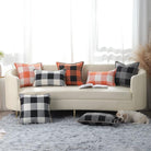 CozyNest Decor fall orange and black buffalo plaid throw pillow covers, 18x18 inches, with stitched edges for autumn farmhouse decor.