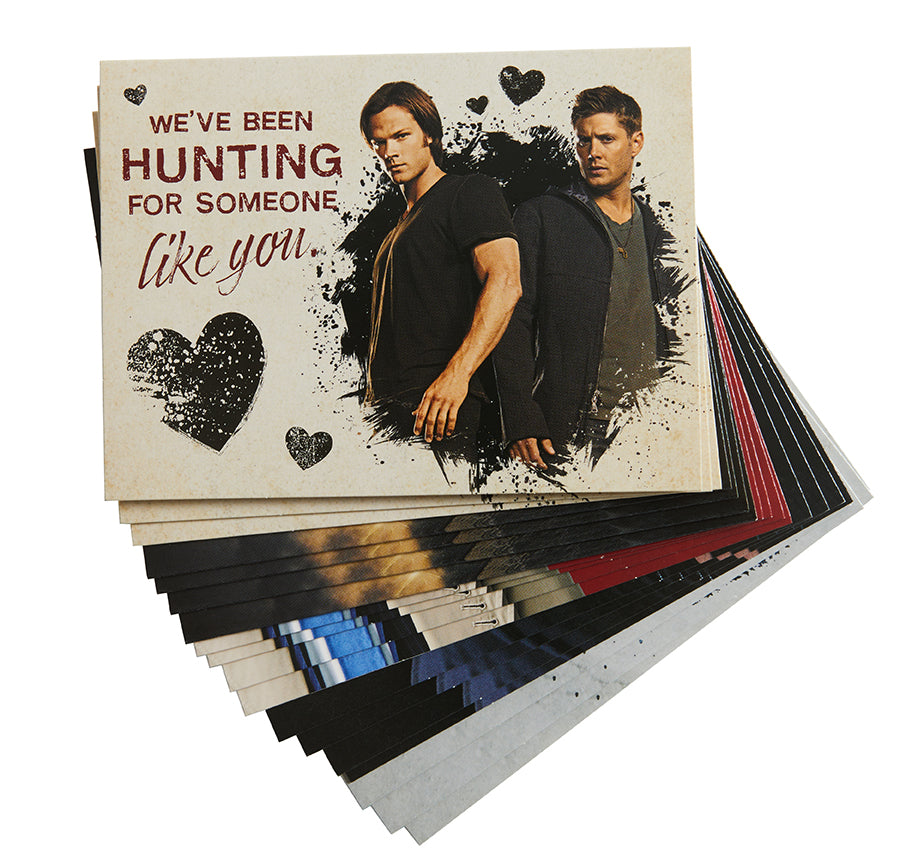 Inside view of hardcover Supernatural Valentine's Day blank boxed note cards by Insight Editions, featuring themed designs.