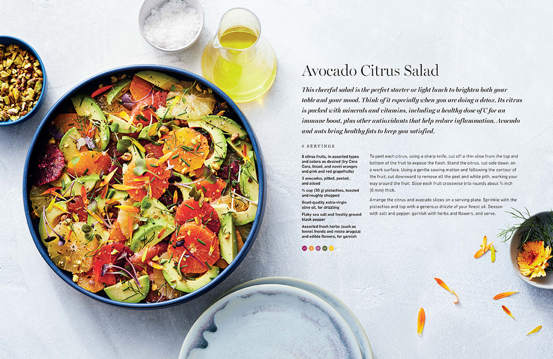 Inside view of the hardcover Everyday Healthy Cookbook by Insight Editions, showing pages with healthy recipes and colorful food photos.
