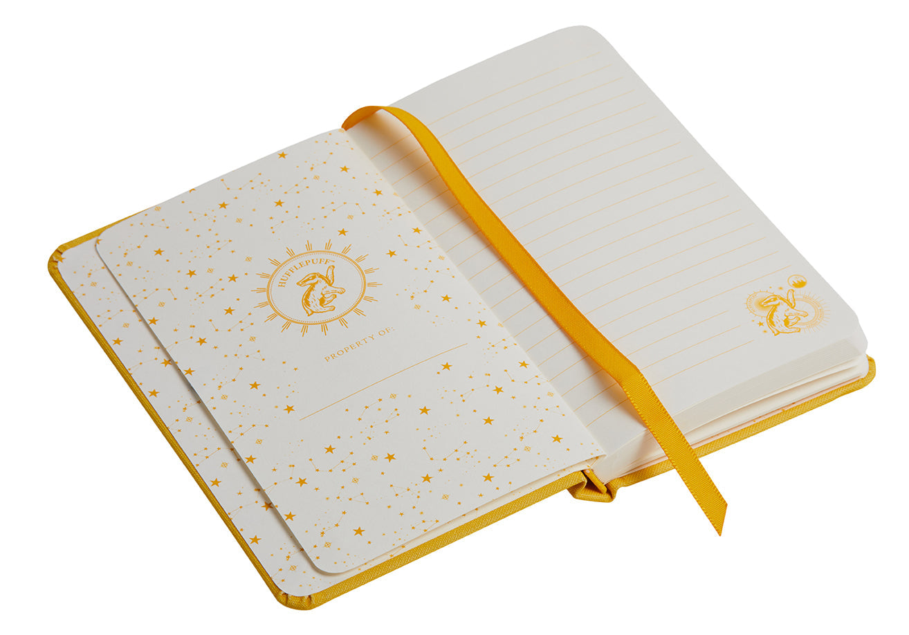 Inside view of Harry Potter Hufflepuff Constellation hardcover pocket journal with ruled pages and celestial Hufflepuff design.