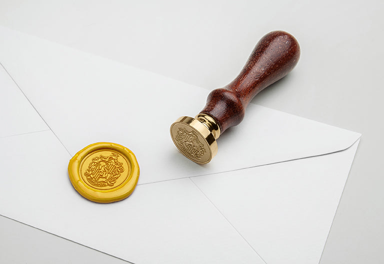 Harry Potter Hufflepuff wax seal set kit with wax sticks, Hufflepuff crest stamp, and sealing accessories from Insight Editions.