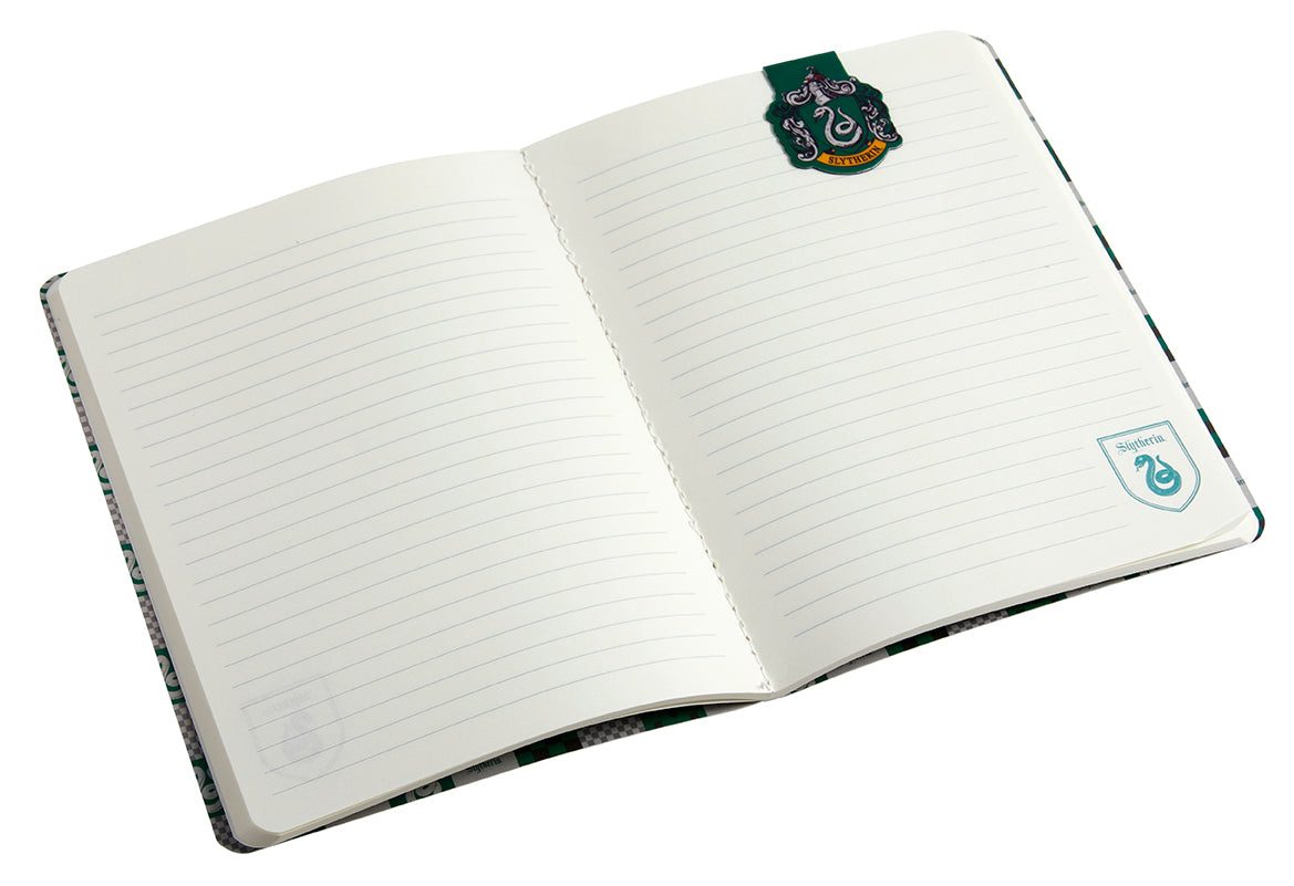 Inside view of a Harry Potter Slytherin notebook with a green cover and a matching page clip set by Insight Editions.