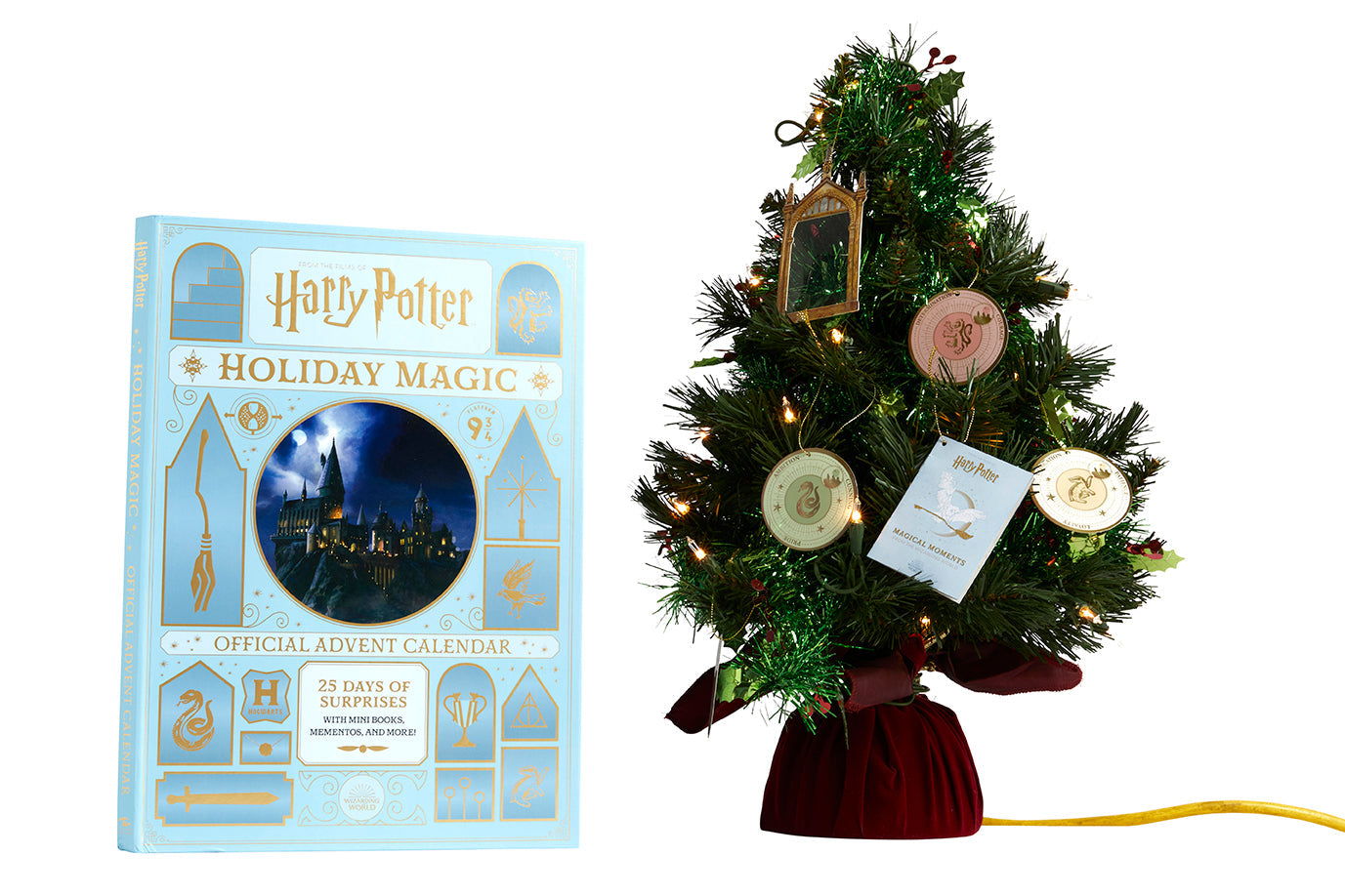 Interior of the hardcover Harry Potter Holiday Magic official advent calendar showing pages and magical themed illustrations.
