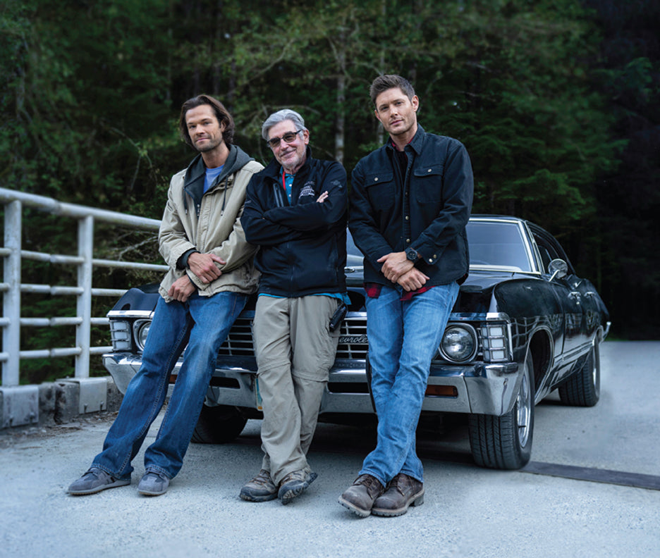 Hardcover edition of Supernatural 15 Seasons: The Crew Member's Souvenir with jacket, featuring interior pages and detailed artwork.