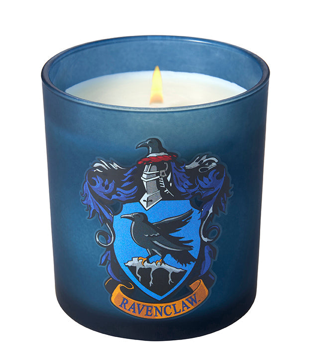 Ravenclaw scented glass candle from Harry Potter home goods collection by Insight Editions, featuring a blue Ravenclaw crest design.