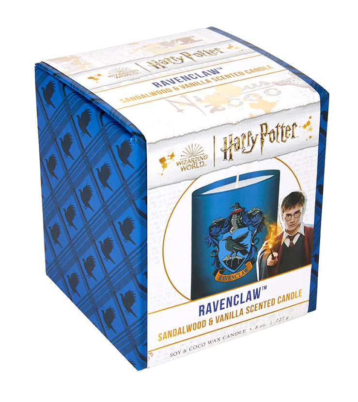 Ravenclaw scented glass candle from Harry Potter home goods collection, featuring blue glass and Ravenclaw emblem design.