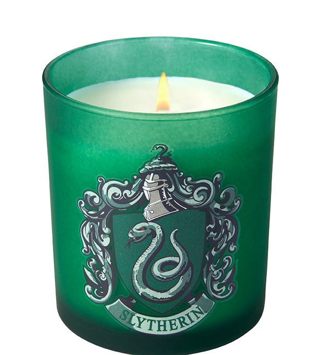 Slytherin scented glass candle from Harry Potter home goods collection featuring green glass and Slytherin crest.