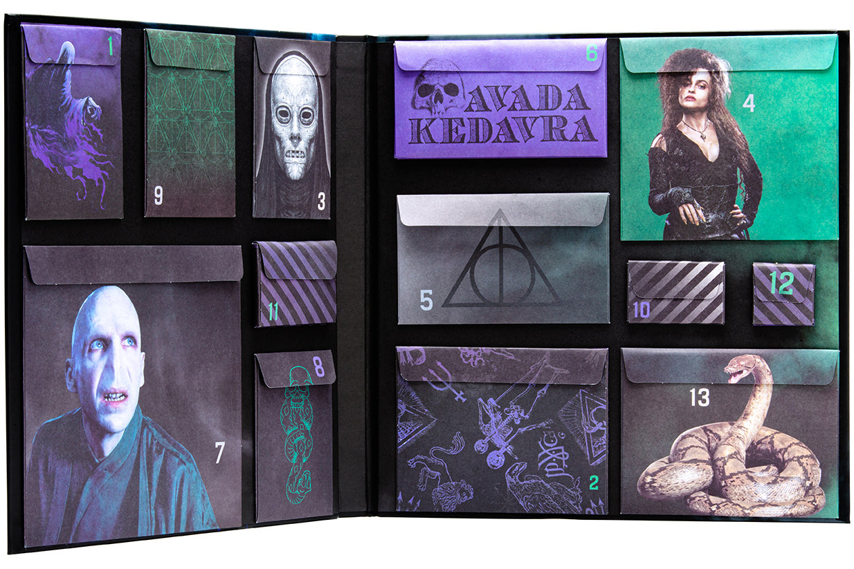 Inside view of the hardcover Harry Potter Dark Arts: Countdown to Halloween book by Insight Editions, showing illustrated pages.