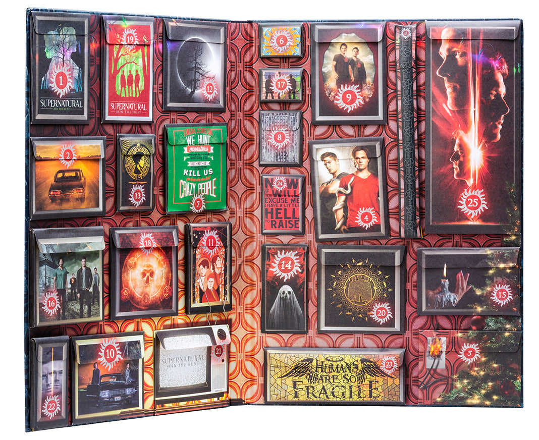 Interior of the hardcover Supernatural: The Official Advent Calendar by Insight Editions, showing detailed pages and festive design.